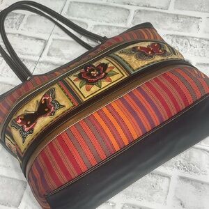 Tote bag shoulder bag. colorful, striped butterfly floral appliqués. Peeling.
